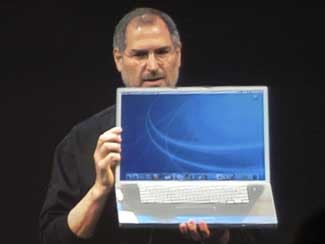 Steve Jobs holding 17 inch Powerbook